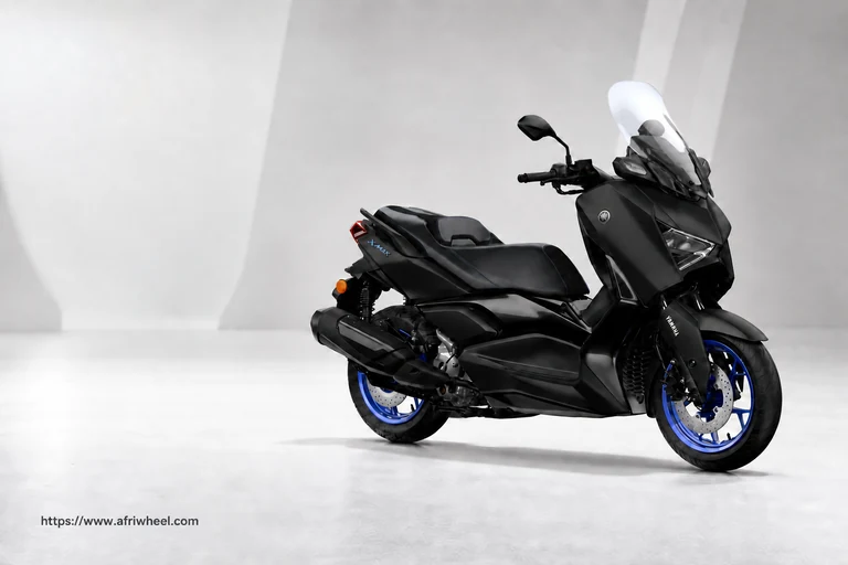 2025 X-MAX 300 in Black, front three-quarter view with blue wheels and tall windscreen