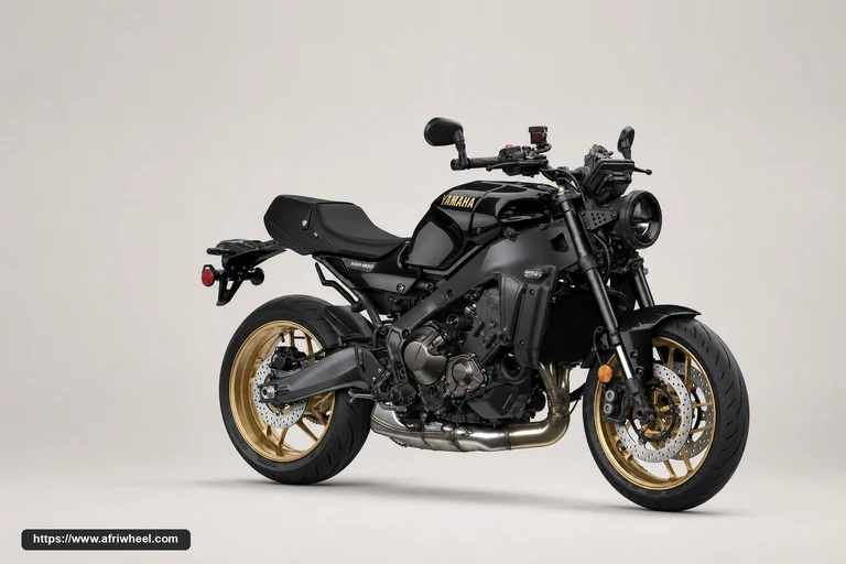 Yamaha XSR900 in Midnight Black, front three-quarter studio view with gold wheels
